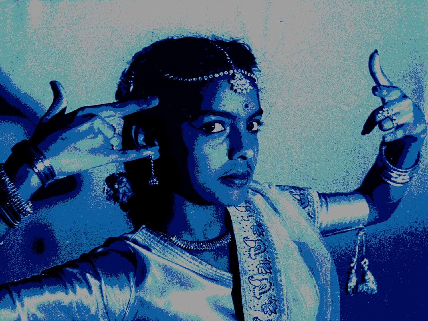 Stylized archival image of Premilladevi Pillay holding a dance gesture